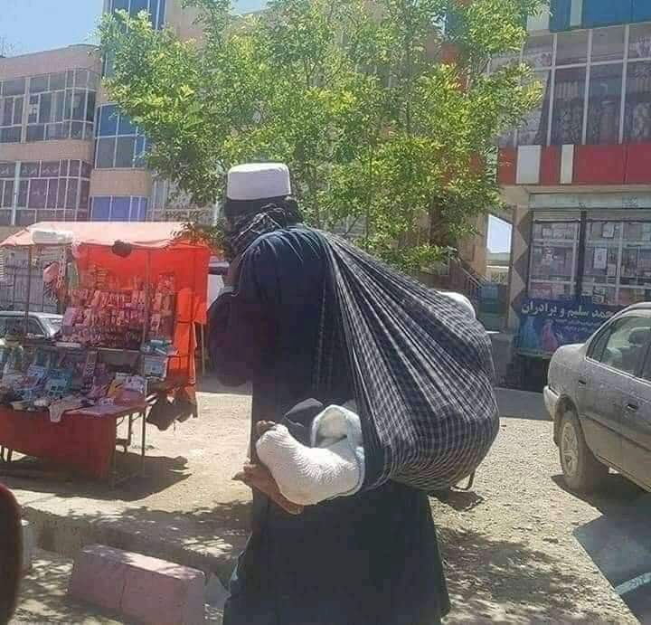 Father Move Injured Child on his Back
