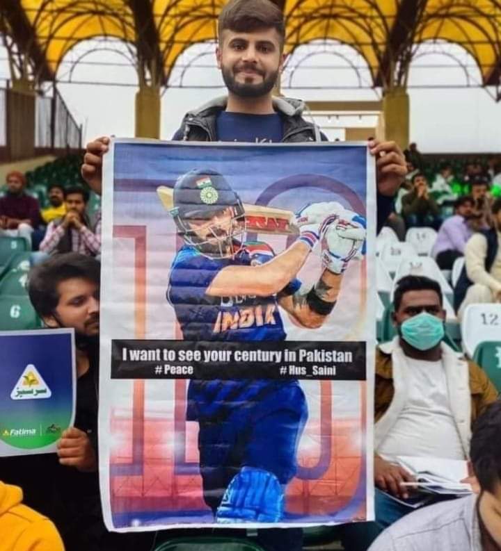 Pakistani fan holds poster of Indian cricketer Virat Kohli in Pakistan