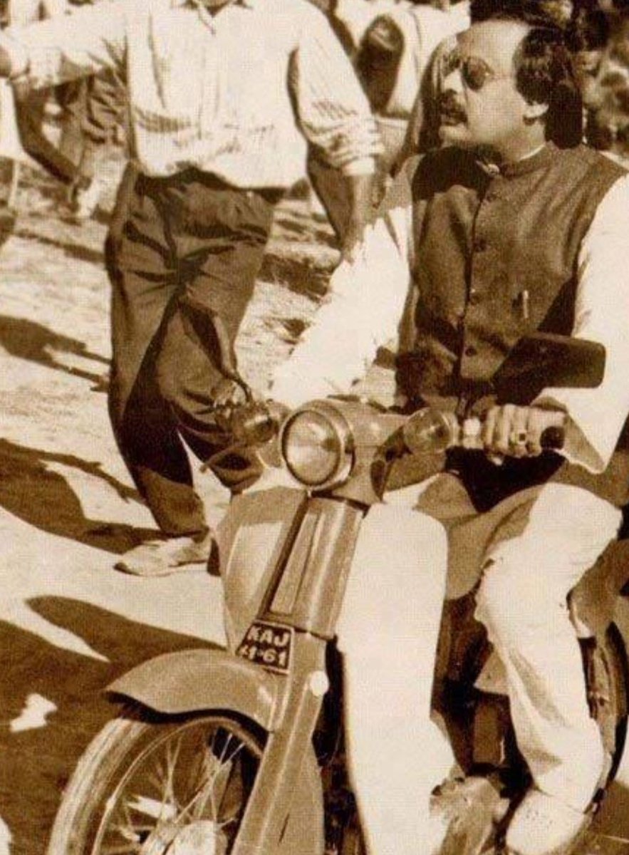 Altaf Hussain riding on Honda 50 Motorcycle